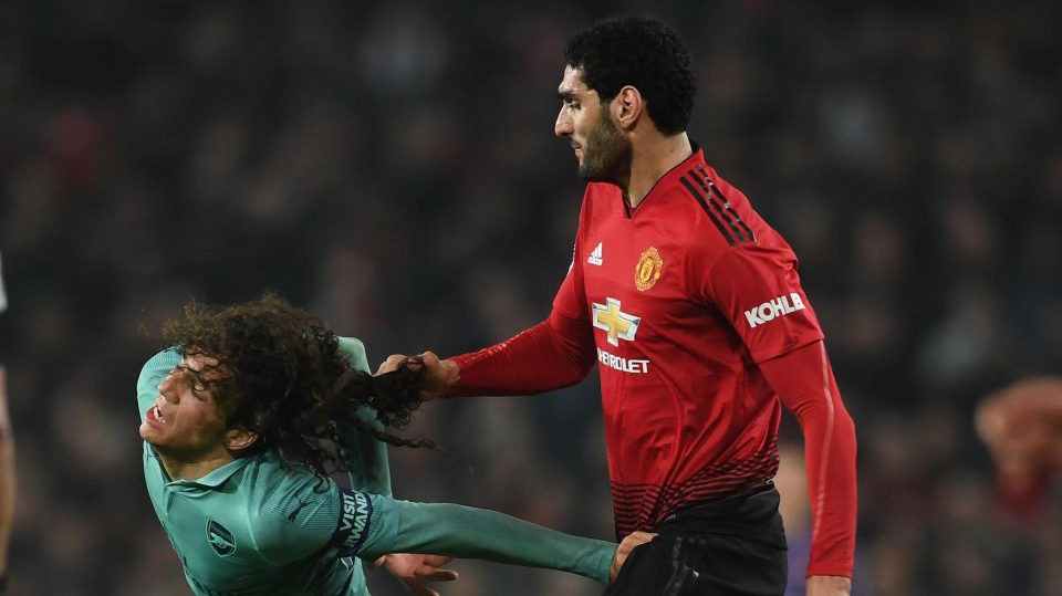 Giật tóc Guendouzi thô thiển, đây là lý do Fellaini cắt bỏ mái tóc xù?