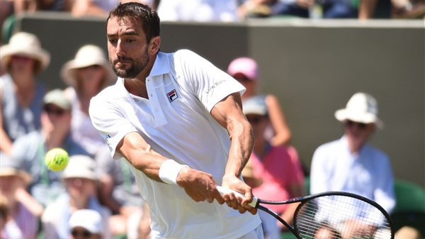 Wimbledon ngày thi đấu thứ 3: Federer nhẹ nhàng vượt ải, nhiều trận bị hoãn vì mưa
