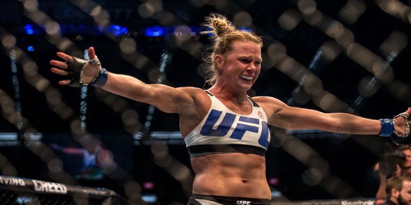Holly Holm ký hợp đồng với APA, Alex Caceres tham gia UFC FN 92